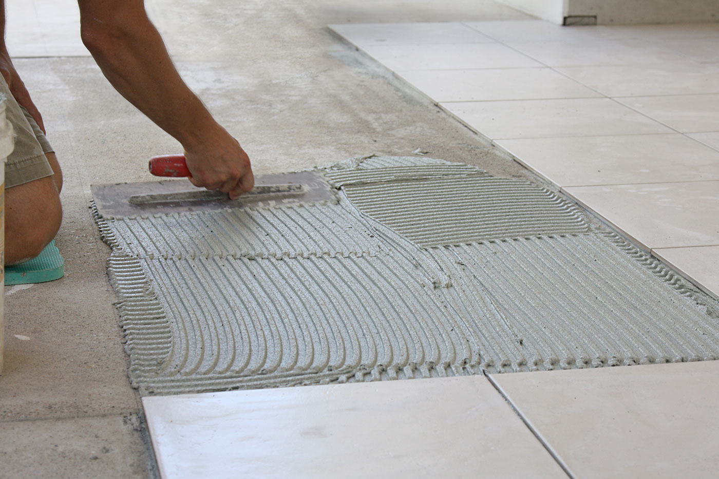 A tiled floor being fitted